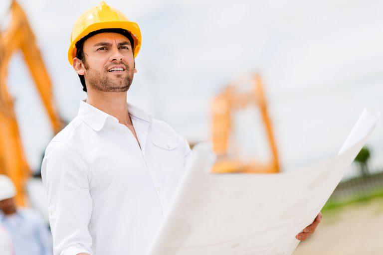 white shirt engineer with yellow safety helmet