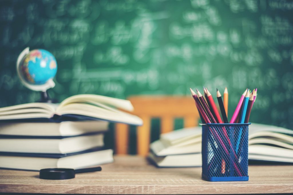 books and pencils on table