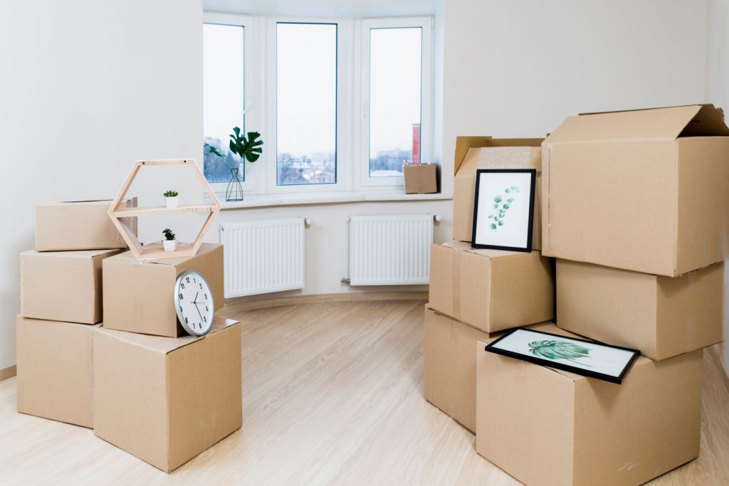 stack-moving-cardboard-boxes-new-apartment