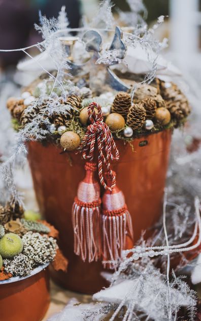 Close Up Photography of Pine Cone in Tassel Bucket