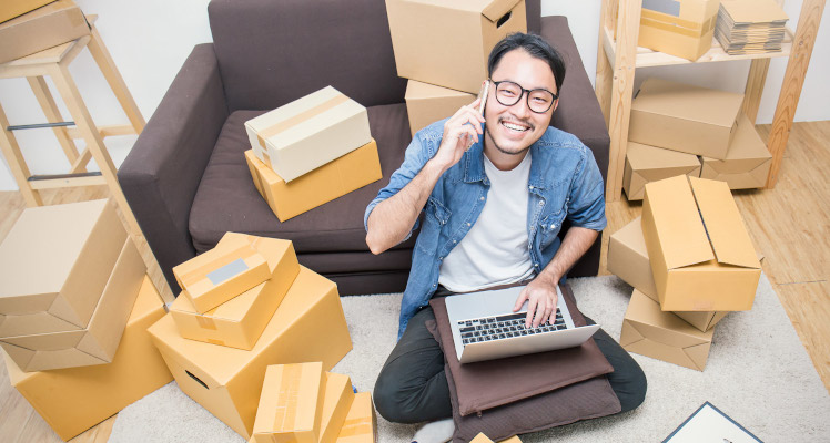 Man organising with cardboard boxes