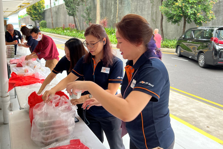 Packing of Food Packets by StorHub Staff